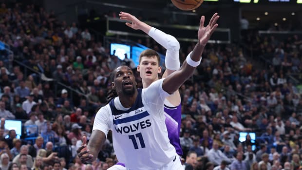 Minnesota Timberwolves center Naz Reid (11) and Utah Jazz center Walker Kessler (24) play for a rebound during the second quarter at Delta Center in Salt Lake City on March 18, 2024.